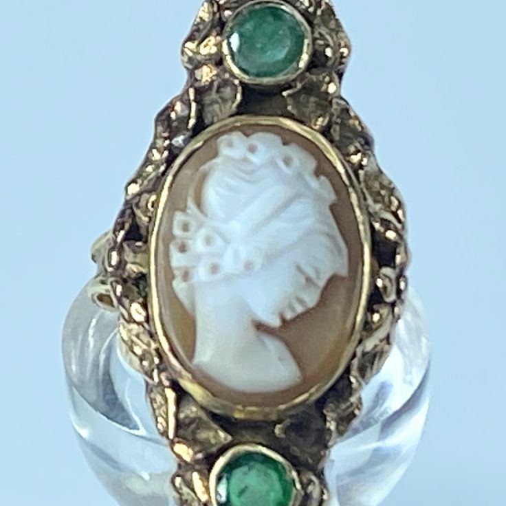 Incredibly Rare 14k Yellow Gold Cameo Ring Set With Hand Carved Shell To Depict The Bust Of A Classical Woman, It Intricate Artwork And Accent With Floral Border Surrounding The Ring. In The Two Ending Has Two Natural Faceted Emerald Gemstones Are Bezel Set Into The Mount. 3.5mm Ring Band With Raised Border. Ring Top Is 40.0mm X 20.0mm, Very Good Antique Condition Material: 14k Assey Mark Ring Size: 9 (1 Inch = 25.4 Mm; 1 Dime = 17.9mm). All Items Are Pre-Owned Unless Otherwise Stated. This Means They Have The Usual Aspects Of Pre-Owned Jewelry, Such As Light Scratches, Wear And Tarnish. Please Review All The Photos Which Will Be Part Of The Description. Intricate Artwork, Floral Ring, Cameo Ring, Carved Shell, Emerald Gemstone, Floral Border, Ring Band, Womens Jewelry Rings, Red Gold