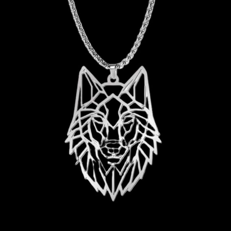 a necklace with a wolf's head in the center and a chain around it