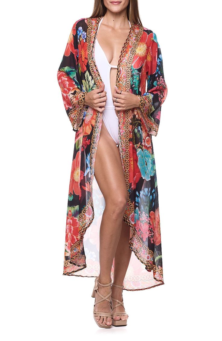 Cover up your beach-ready look with this lightweight duster covered in a floral pattern. Open front Long sleeves 100% polyester Hand wash, dry flat Imported Summer Black Floral Print Kimono, Black Floral Print Kimono For Summer, Bohemian Printed Spring Swimwear, Bohemian Printed Swimwear For Spring, Floral Print Beachwear Cover-up For Spring, Spring Floral Print Swimwear For Beach Cover-up, Floral Print Swimwear For Spring Beach Cover-up, Spring Floral Print Swimwear For Beach, Summer Floral Print Cover-up For Beach Season