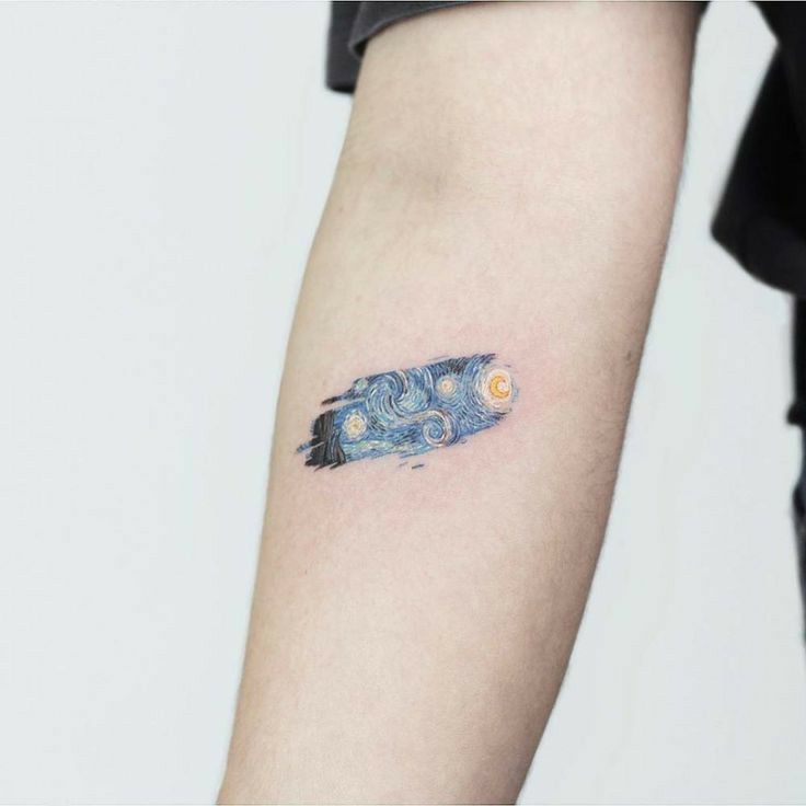 a person with a tattoo on their arm that has the starry night painting on it