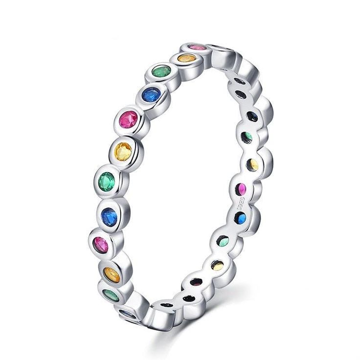 Add a touch of color to your daily look with this stunning Rainbow Radiance Ring. Made from 925 sterling silver, this luxurious piece of fine jewelry is adorned with sparkling cubic zirconia stones in a rainbow of colorful hues. The intricate design features a cluster of round-cut zirconias set in a prong setting, giving the ring a truly elegant and sophisticated look. Whether you're dressing up for a special occasion or simply adding a finishing touch to your casual outfit, this ring is sure to make a statement. The durable 925 sterling silver construction and high-quality cubic zirconia stones ensure that this ring will be a durable and long-lasting addition to your jewelry collection. So, it is a perfect gift for any occasion. Luxury Fine Jewelry Stackable Rings With Round Cut, Luxury Stackable Rainbow Rings, Finger Ring For Women, Stackable Birthstone Rings, Daily Accessories, Rainbow Ring, Stylish Lady, Trendy Ring, Fashion Female