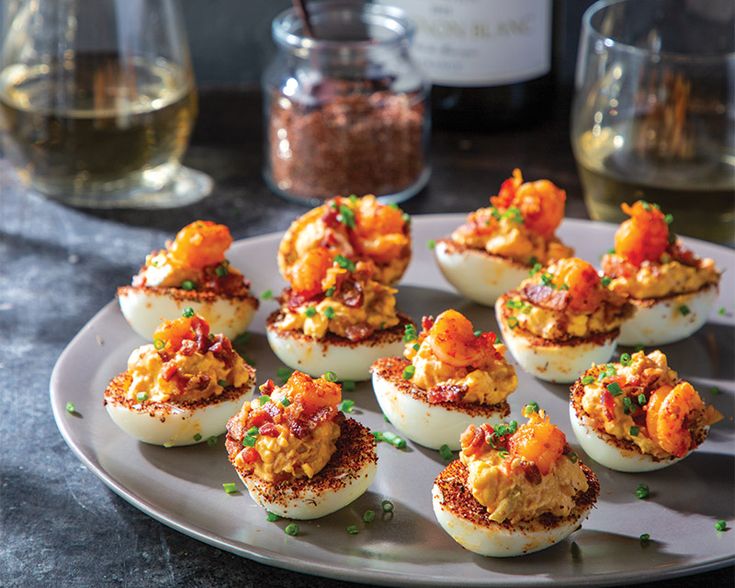 several deviled eggs are arranged on a plate