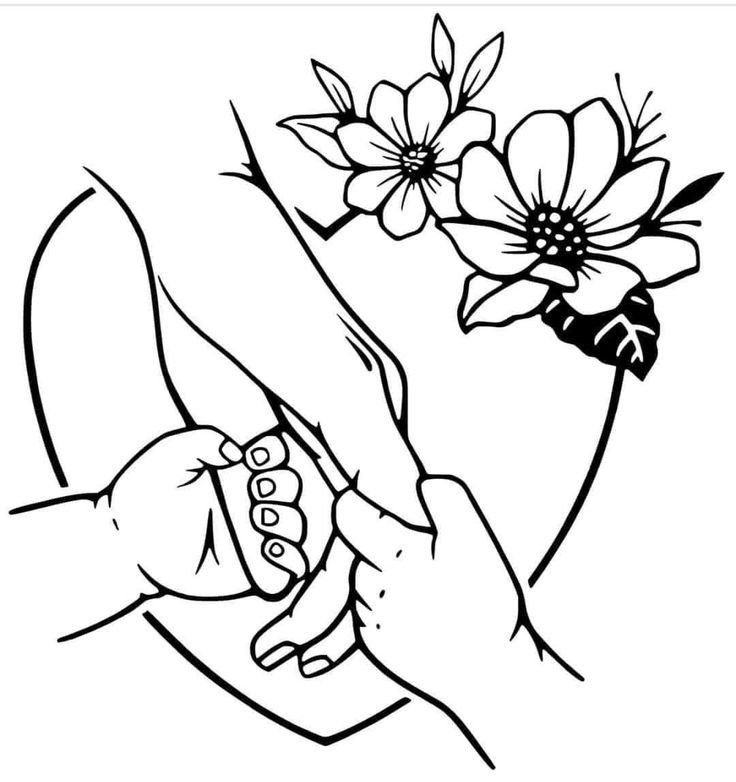 two hands holding each other over a flower