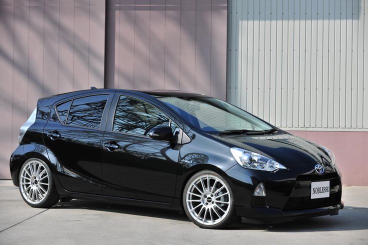 a black car parked in front of a building