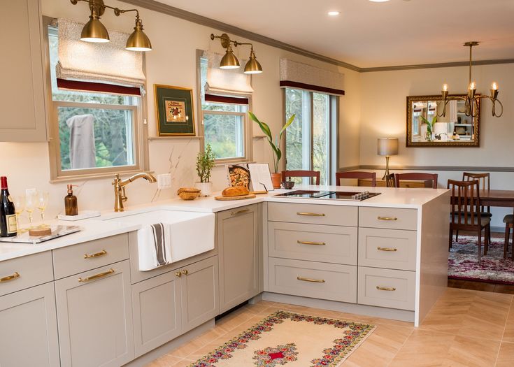 a kitchen filled with lots of counter top space next to a dining room table and chairs