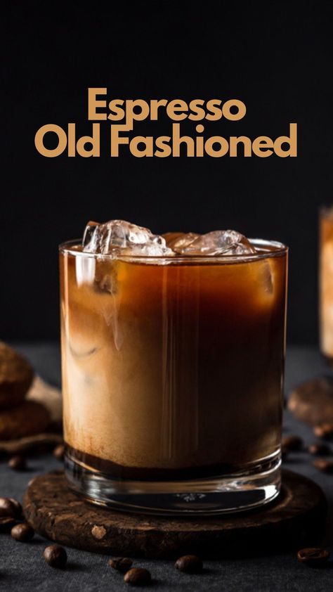 espresso old fashioned cocktail in a glass with ice and coffee beans around it