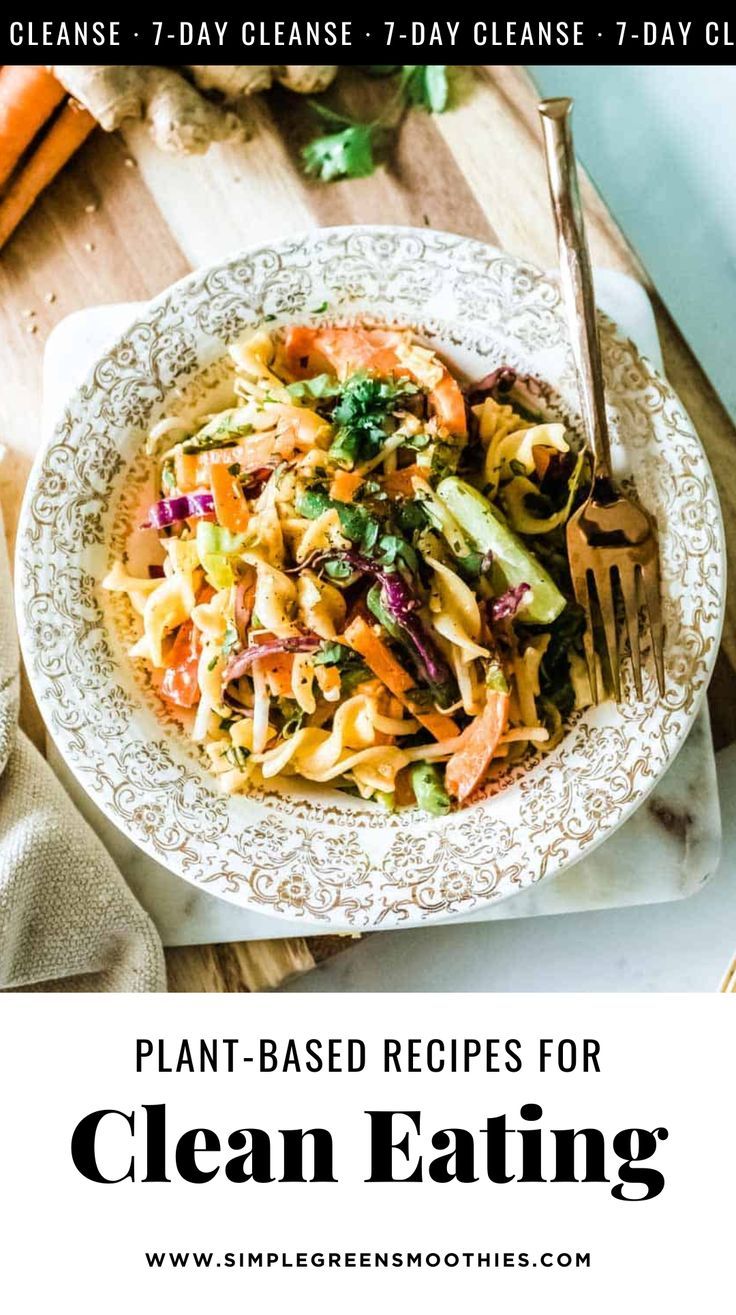 a white plate topped with pasta and vegetables