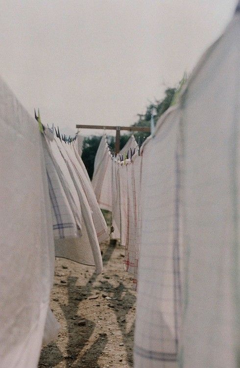 some white towels are hanging out to dry