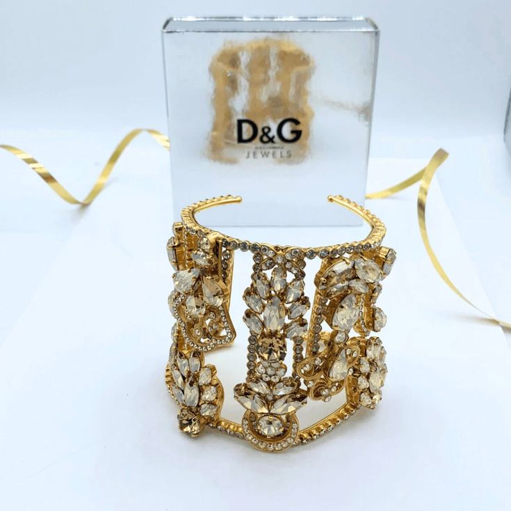 Dolce & Gabbana cuff bracelet Crystals Signed Luxury Cuff Bracelet For Parties, Luxury Cuff Bangle Bracelet For Party, Luxury Cuff Bracelets For Party, Glamorous Gold Cuff Bracelet Gift, Designer Cuff Bracelet For Parties, Glamorous Adjustable Cuff Bracelet Gift, Luxury Adjustable Cuff Bracelet For Party, Glamorous Adjustable Cuff Bracelet As Gift, Adjustable Luxury Cuff Bracelet For Parties