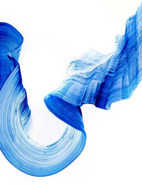 an abstract painting with blue and white lines on the bottom, as if in motion