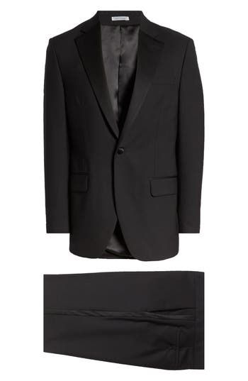 Fine wool and handsome satin trim define a clean, tailored tuxedo that's ready for elegant evenings and special occasions. Jacket has peaked lapels Partially lined 100% wool Dry clean Made in Canada Black Tuxedo Suits With Structured Boning, Black Tuxedo With Structured Boning, Semi-formal Silk Tuxedo With Single Button, Silk Single-button Tuxedo For Semi-formal Occasions, Silk Single Button Tuxedo For Semi-formal Occasions, Semi-formal Single Button Silk Tuxedo, Classic Formal Tuxedo With Structured Boning, Elegant Tailored Tuxedo With Welt Pockets, Elegant Tailored Tuxedo With Flat Front