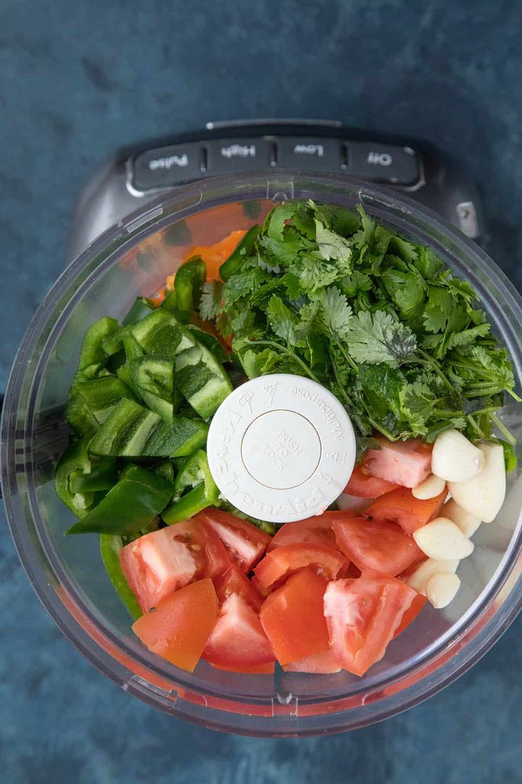 chopped vegetables in a food processor ready to be blended