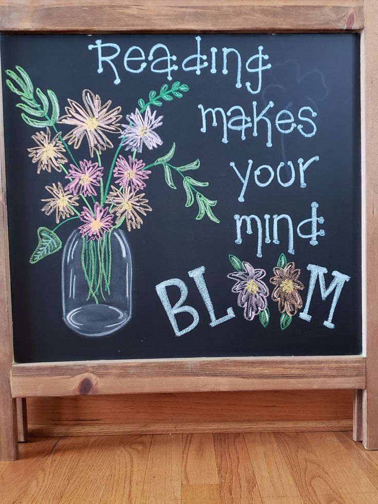 a chalkboard with writing on it that says reading makes your mind blm