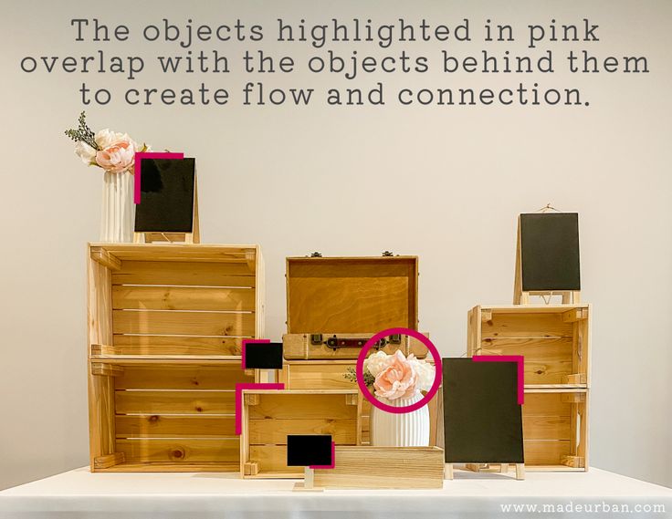 an arrangement of wooden crates with flowers on top and the words, the objects highlighted in pink overlaid with the objects behind them to create flow and connection