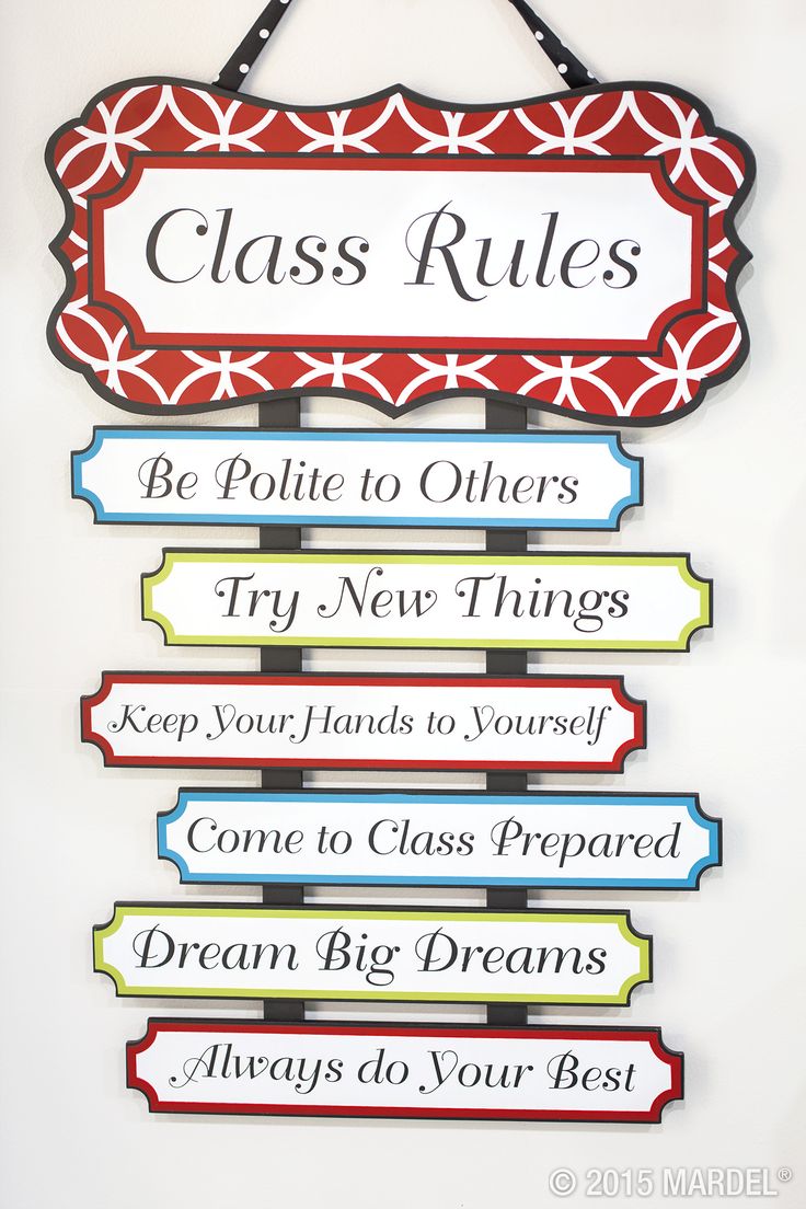 a sign hanging from the side of a wall that says class rules be polite to others try new things keep your hands to yourself come