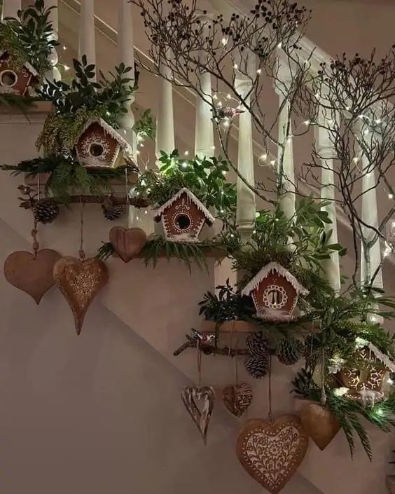 christmas decorations are hanging on the stairs