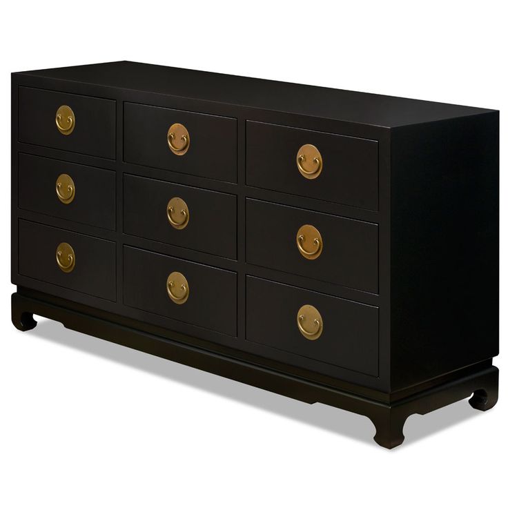 a black dresser with gold knobs on the top and bottom drawers, in front of a white background