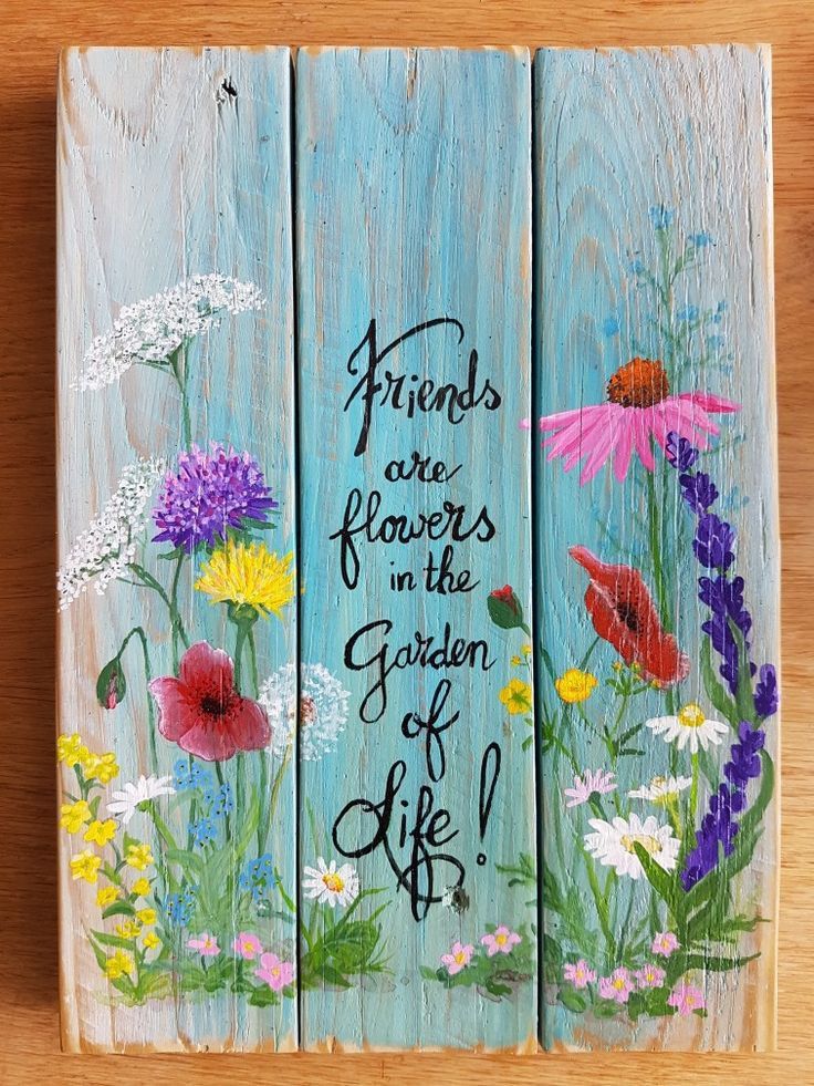 three painted wooden boards with flowers on them and the words friends are flowers in the garden of life