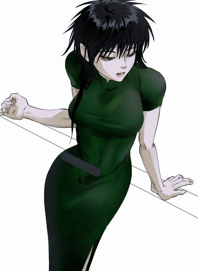 a woman in a green dress is holding onto a pole with her hands and looking down at the ground