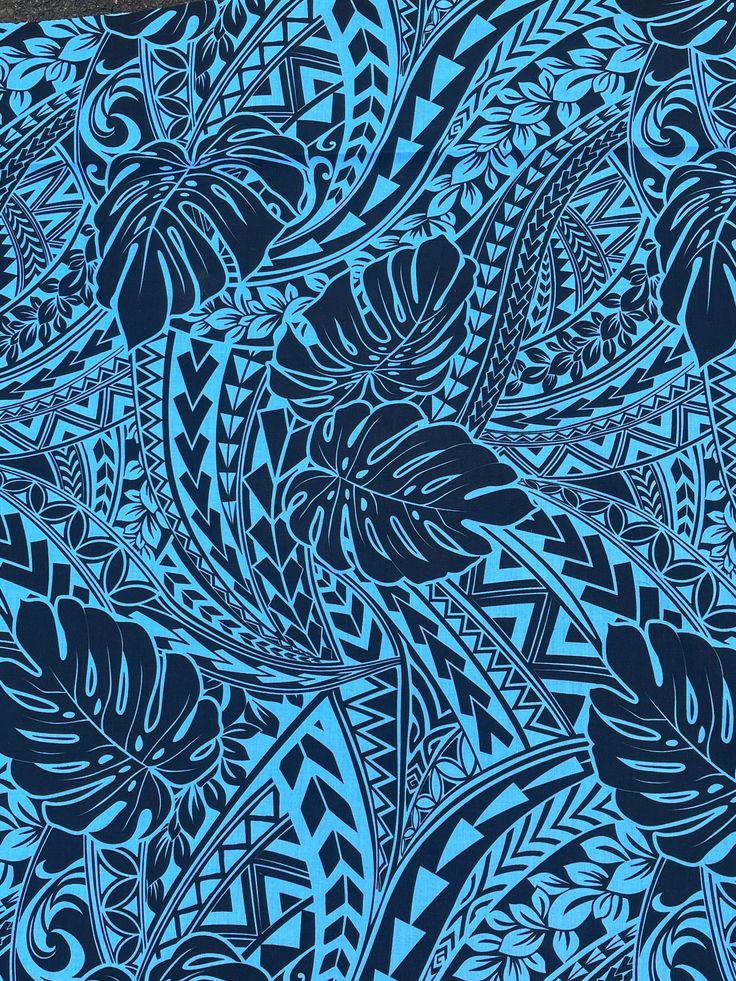 a blue and black pattern with leaves on it