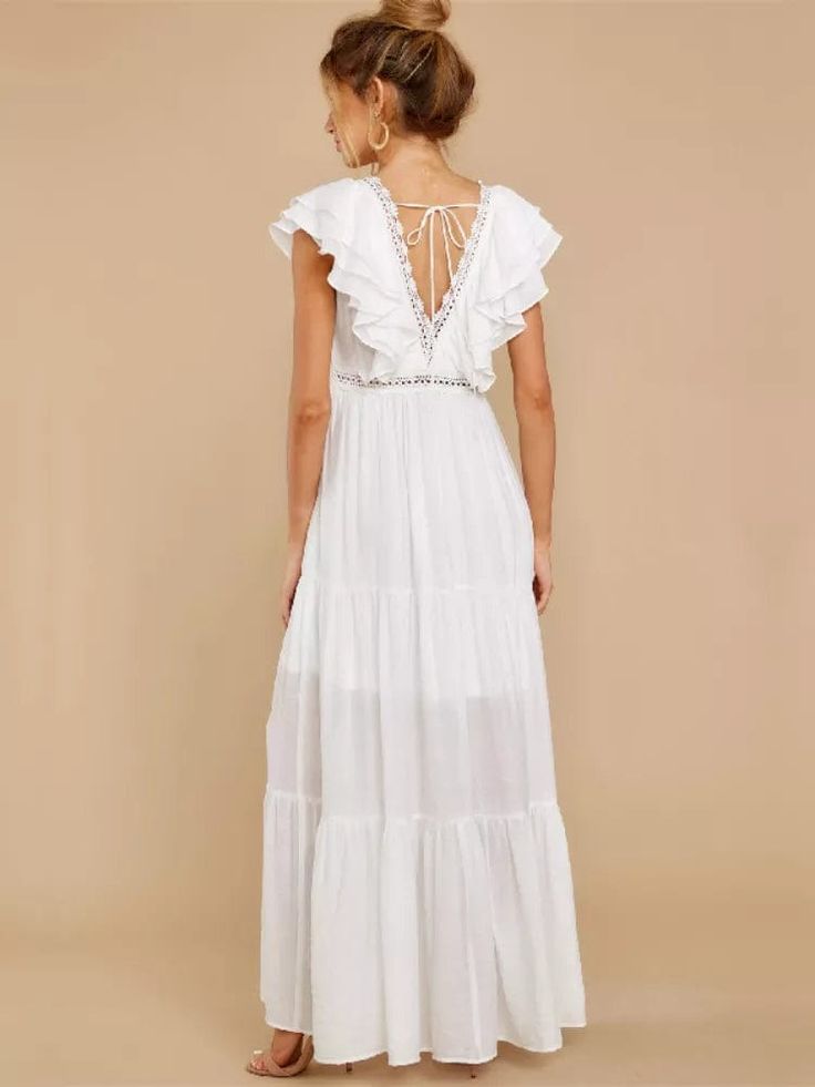 Are you looking for the chicest boho dresses in town? Look no further than our exclusive piece in pristine white, with captivating ruffle detailing at the neck. This boho maxi dress in white, with an empire waistline and a dreamy a-line silhouette can transform you into an ethereal goddess. Wear this ultimately stunning bohemian dress or pair it with statement boho jewelry and stilettos for a truly stunning look. Sleeveless Ruffled V-neck Polyester material Ankle-length boho maxi Solid pattern H White Tiered Ruffle Maxi Dress, Elegant Boho Maxi Dress For Brunch, Bohemian Ruffled Maxi Dress For Vacation, Chic Flowy Maxi Dress For Beach Wedding, Flowy Boho Maxi Dress With Ruffles, Bohemian Tiered Maxi Dress For Brunch, Summer Boho Maxi Dress With Ruffles, Chic Maxi Dress For Beach Wedding, Summer Style Boho Maxi Dress With Ruffles