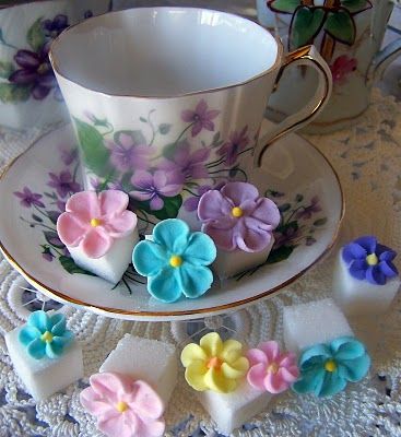 tea cups and saucers with flowers on them