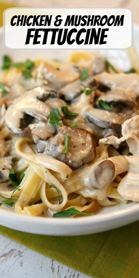 chicken and mushroom fettuccine on a white plate