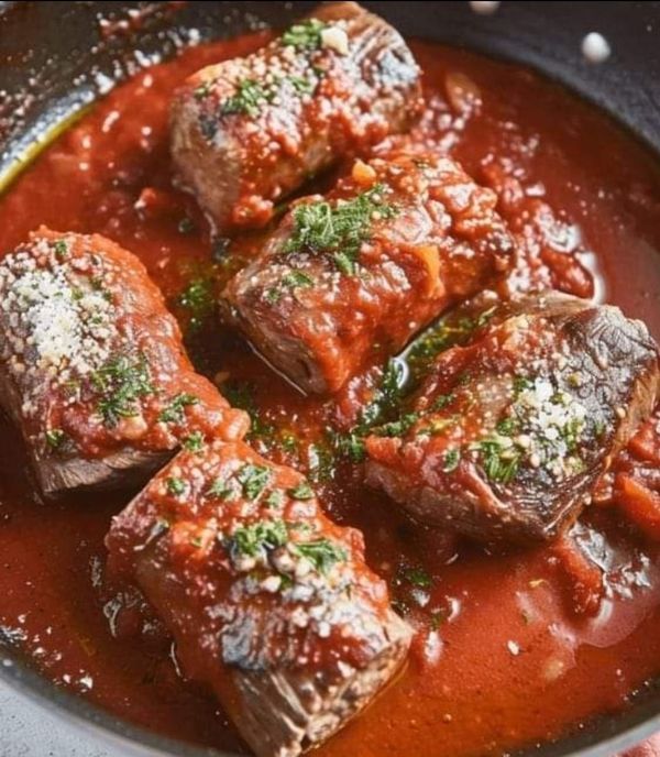 some meatballs and sauce are in a pan