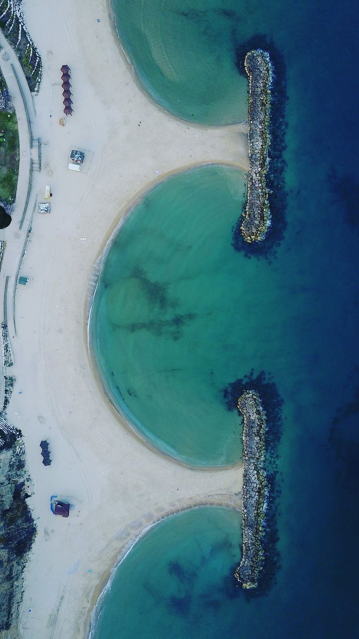 an aerial view of the beach and ocean