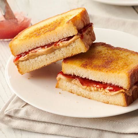 two grilled sandwiches sitting on top of a white plate