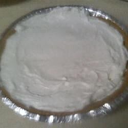 a metal pan filled with white powder on top of a table