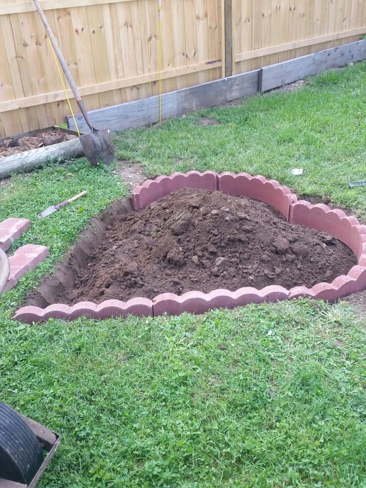 a pile of dirt sitting in the middle of a yard