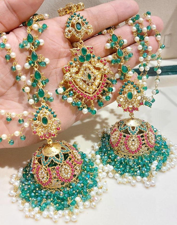 Accessorise with a bit of colour and the latest fashion Stunning statement new in Nauratan Jhumkey Earrings with Stunning Saharey and Tikka Set in Gold Finishing with a contrast of Mint Green, White and Red Beads Statement Accessory Item to bling up any outfit to wear at any special occasion Eid Jewellery, Mehndi Wedding, Bridal Accessories Jewelry, Islamabad Pakistan, Bridal Bangles, Bridal Mehndi, Jewellery Accessories, Kundan Jewellery, Red Bead