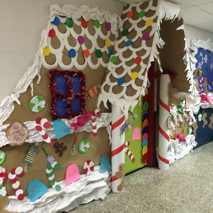 several decorated gingerbread houses in a hallway