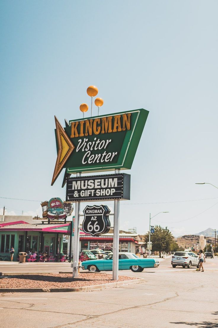 a sign for the kingman visitor center and gift shop