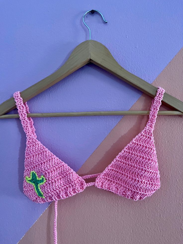 Handmade crochet top in pink. Tied in the back. It has a cactus detail. Size XS-S. Trendy Pink Crochet Top, Trendy Pink Triangle Crop Top, Trendy Pink Triangle Top, Pink Casual Triangle Crop Top, Casual Pink Triangle Crop Top, Pink Cotton Crochet Top Trendy, Pink Crochet Crop Top For Vacation, Pink Triangle Top Crop Top For Vacation, Pink Crochet Top For Spring Vacation