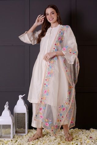 White chanderi kurta with thread embroidered borders. Comes with pant and an organza dupatta. - Aza Fashions Bollywood Style Tussar Silk Palazzo Set With Embroidered Border, Diwali Tussar Silk Palazzo Set With Embroidered Border, Navratri Cotton Silk Dupatta With Floral Embroidery, Transitional Off White Dupatta With Resham Embroidery, Traditional Tussar Silk Palazzo Set With Embroidered Border, Off White Chanderi Traditional Wear With Embroidered Border, White Tussar Silk Traditional Wear With Embroidered Border, Traditional Slub Silk Dupatta With Floral Embroidery, Transitional Chanderi Dupatta With Floral Embroidery