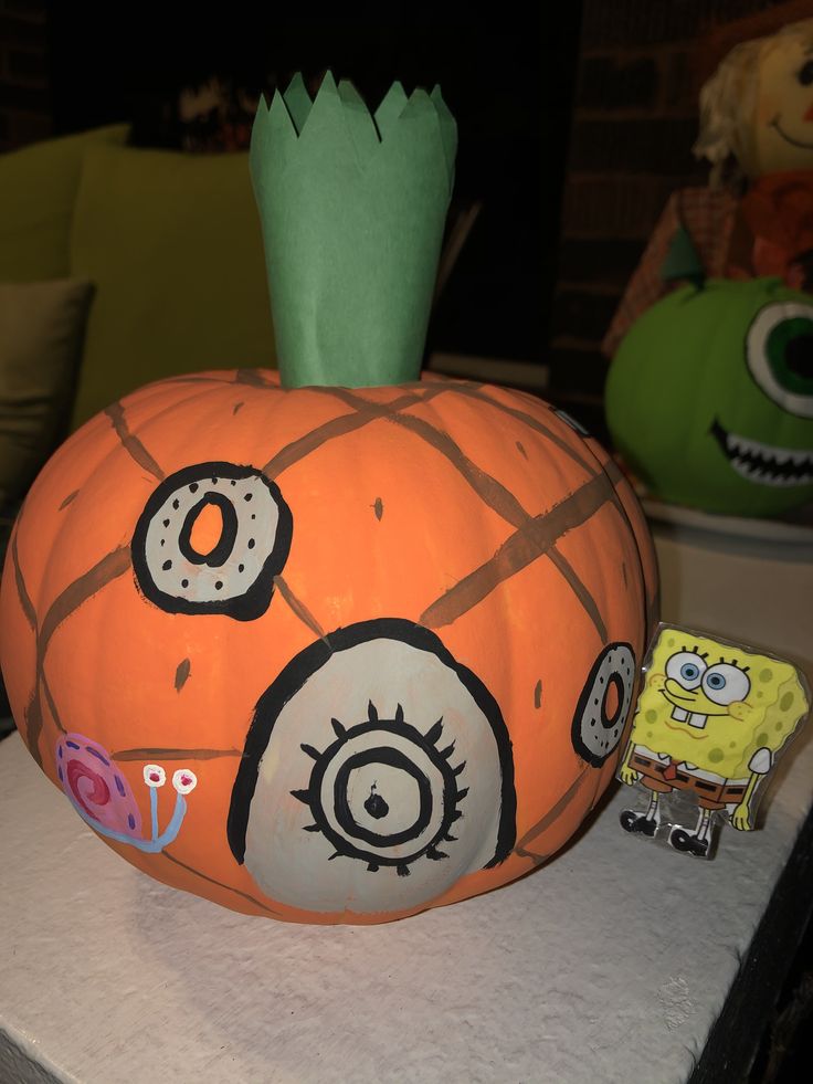 a large pumpkin decorated to look like a cartoon character