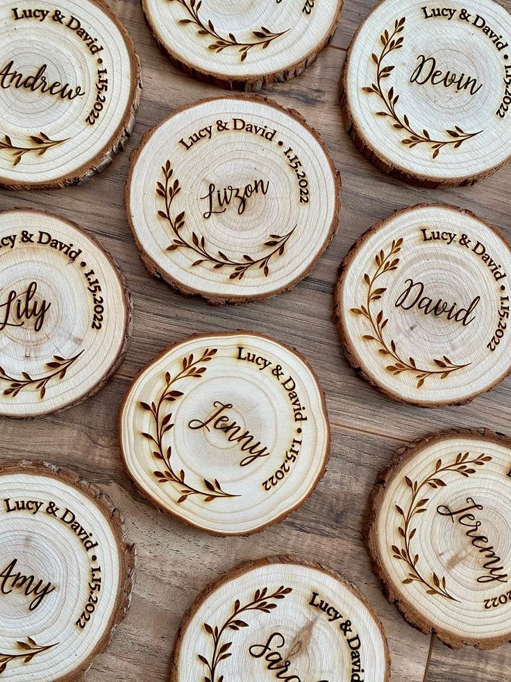 wooden coasters with names on them sitting on a table