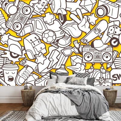 a bedroom with yellow and white wallpaper that has various items on it, including a bed