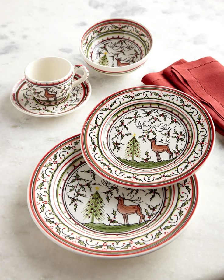 three plates and two cups on a table