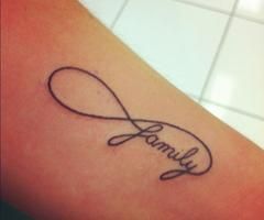 a tattoo with the word family written in cursive writing on it's arm