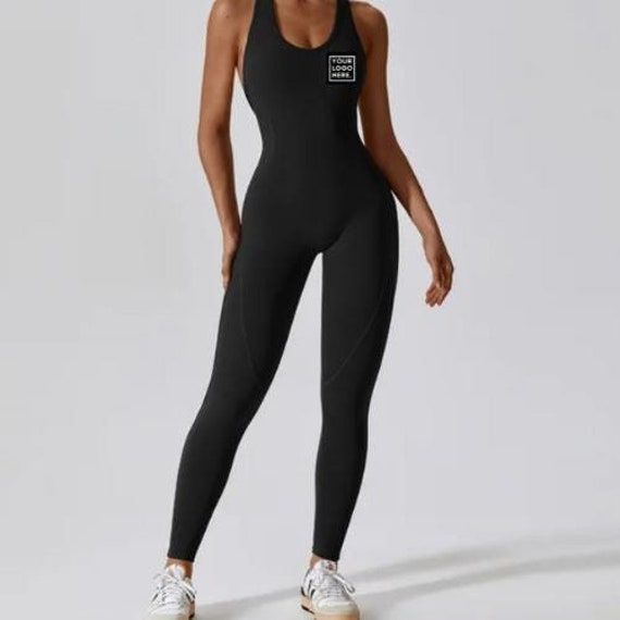 Custom Women's Workout Jumpsuit | Personalized Activewear for Style & Performance Elevate your workout wardrobe with our custom women's workout jumpsuit! Designed for the modern fitness enthusiast, this jumpsuit combines functionality, comfort, and personalized style. Whether you're hitting the gym, practicing yoga, or just want to make a fashion statement, our custom jumpsuits are the perfect blend of performance and unique design. Why Choose Our Custom Workout Jumpsuit? - Premium Fabric: Made from a high-quality, moisture-wicking blend that keeps you cool, dry, and comfortable during your most intense workouts. - Sleek & Supportive Fit: Our jumpsuit is designed to hug your body in all the right places, offering both support and flexibility for maximum movement. - Vibrant Custom Prints: W Breathable Fitted Bodysuit For Gym, Fitted Moisture-wicking Jumpsuits For Workout, Black Sportswear Jumpsuits And Rompers For Gym, Fitted Moisture-wicking Jumpsuits And Rompers For Workout, Sporty Moisture-wicking Jumpsuits For Gym, Fitted Athleisure Jumpsuit For Workout, Fitted Sporty Activewear With Letter Print, Fitted Letter Print Activewear For Yoga, Sporty Fitted Activewear With Letter Print