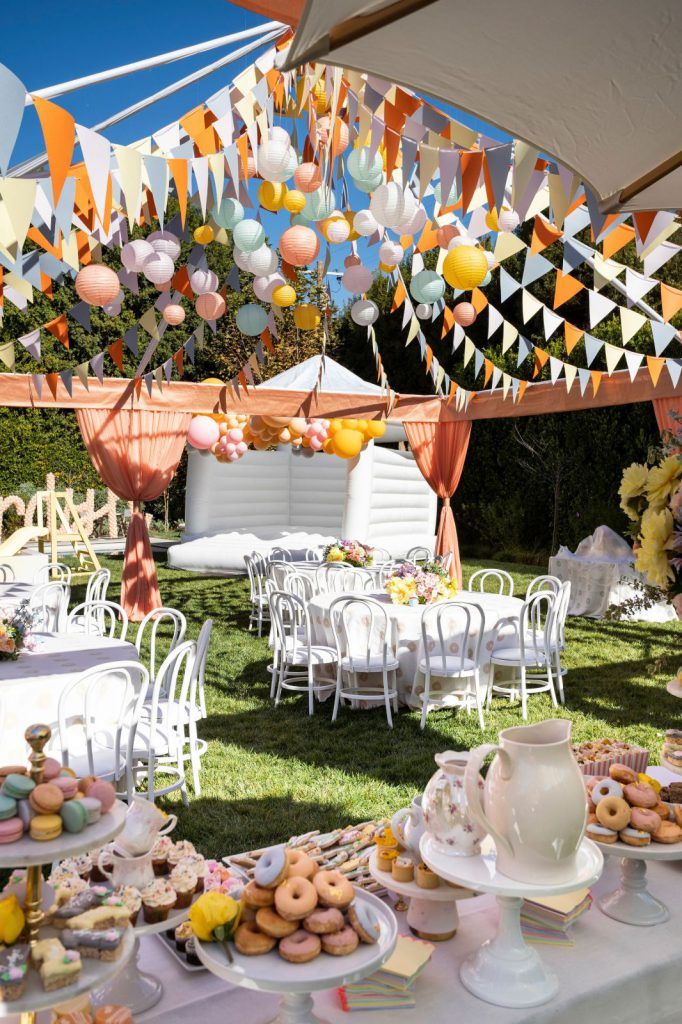 an outdoor party with lots of food and decorations