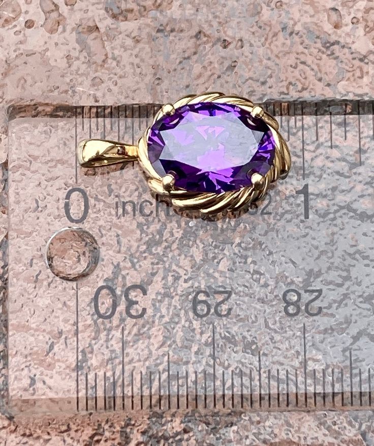 "~ Vintage, 14K Gold, Purple CZ Amethyst Oval Pendant. Its .92\" High By .53\" Across & Weighs Approximately 4.53 Grams On My Scale. In Good Condition. ~ Due To The Unique Nature Of Antiques & Vintage Items, They Are Being Sold As Is. Please Keep In Mind, That Most Of All Antiques & Vintage Items Will Show Wear & Imperfections Consistent With Their Age And Use. Please Look At The Pictures Provided & Any Questions Please Don't Hesitate To Ask ~" Oval Birthstone Gemstones In 14k Gold, Oval Purple Diamond Cut Jewelry, Purple Oval Diamond Cut Jewelry, Gold Amethyst Ring With Diamond Cut, Oval Shape, Gold Oval Amethyst Ring With Diamond Cut, Purple Oval 14k Stamped Jewelry, Oval Amethyst Gemstones With Prong Setting, Oval Amethyst Ring With Diamond Cut, Oval Diamond Cut Amethyst Ring