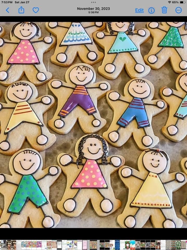 an image of gingerbread men and women in the shape of people with different colors on them