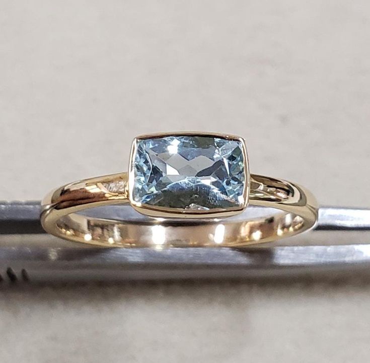 1. Aquamarine 14k Gold Ring 2. Stamped 3. Gemstone - Aquamarine 4. Jewelry Type - Gold Ring 5. Total Weight - 2.310 Gram Approx. 6. Aquamarine Weight - 0.65 Carats  7. Gold Weight - 2.180 Grams Approx. 8. Aquamarine Size - 7 x 4 MM 9. Gold Purity - 14k 10. Band Size - 2 MM 11. Handmade Items 12. AAA Quality Ring 13. Stackable Ring 14. 1 Quantity Available 15. Ready to Dispatch in 1 - 2 days. 16. Rare Color  Pictures are taken under natural and day light. Aquamarine Bezel Set Ring For Anniversary, Anniversary Aquamarine Ring With Bezel Setting, Formal Aquamarine Topaz Ring With Bezel Setting, Gold Aquamarine Gemstone Ring, Gold Aquamarine Jewelry With Natural Stones, Yellow Gold Aquamarine Gemstone Jewelry, Yellow Gold Aquamarine Ring As Gift, Aquamarine Crystal Gift Ring, Aquamarine Gold Ring