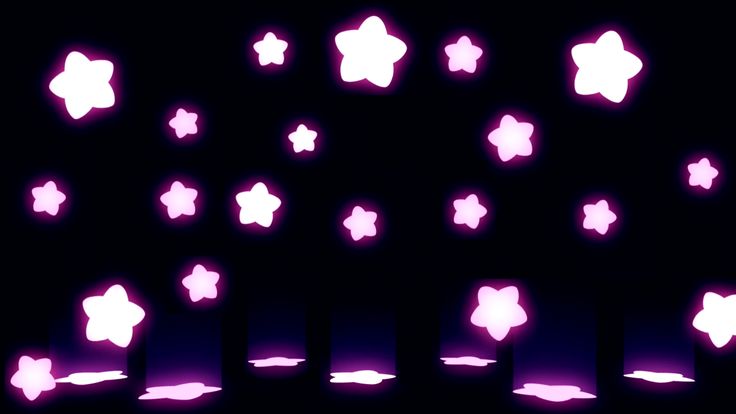 many pink stars are glowing in the dark