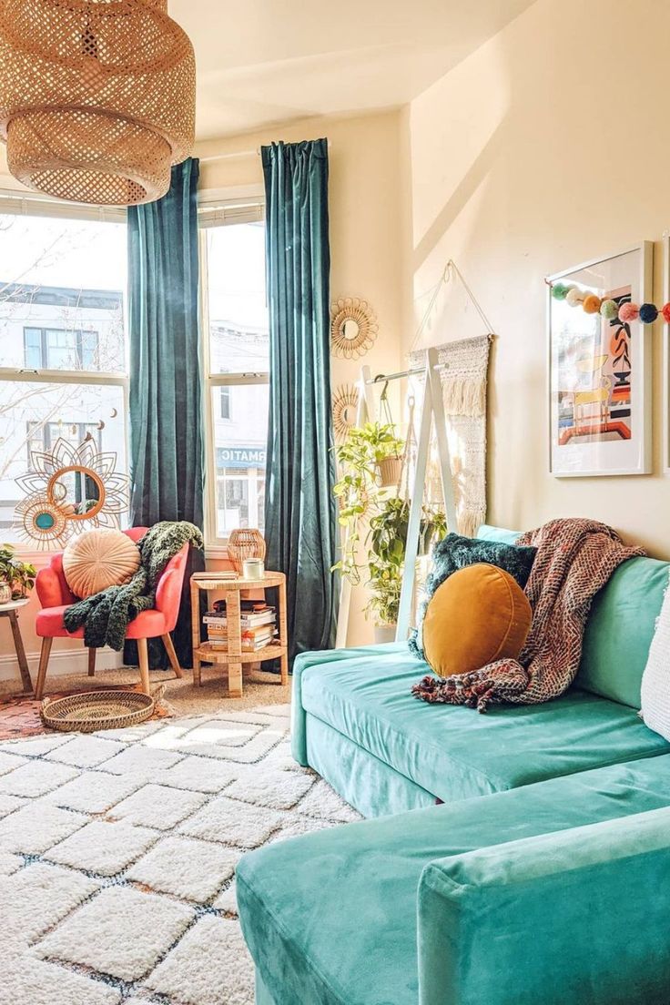 a living room filled with furniture next to a window