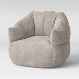 a beige chair with a round shaped cushion